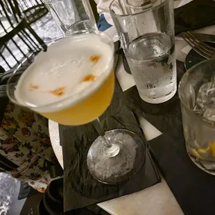 a table with drinks and glasses