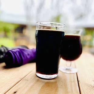 two glasses of beer and an umbrella