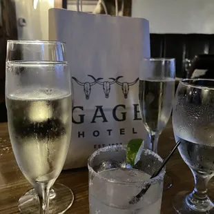two glasses of wine and a bag of ice