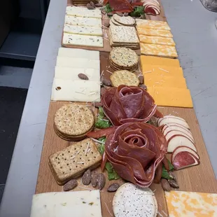 a long table of cheese and meats