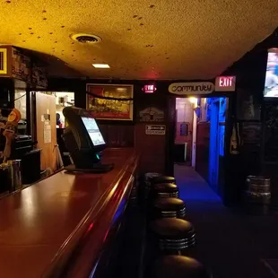 a bar with a television in the background