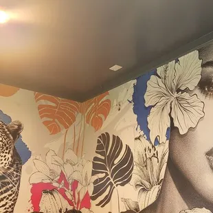 a mural of a woman and a leopard