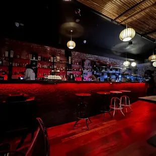 a bar with red lighting