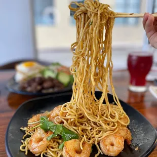 a plate of noodles and shrimp