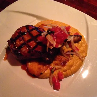 Bone in pork chop with sweet potatoes.