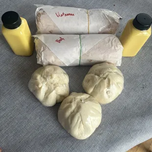 Two banh mi, 3 banh beo, two corn milk.