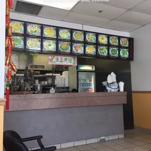 Counter with outdated food board.