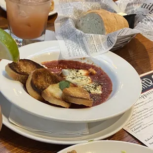 Sad sad tiny goat cheese app with 4 pieces of burned toast for like $13. Even the bread basket is hard and inedible.