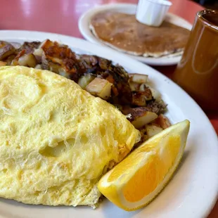 Italiano omelette with breakfast home fries and blueberry pancakes