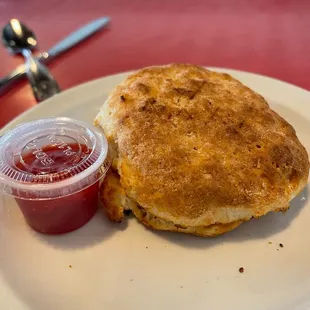 a biscuit with a side of ketchup