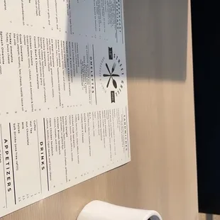 a cup of coffee on a paper towel holder