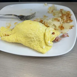 This is a ham and cheese omelette half eaten with over half of the hash browns eaten! It's just to give you an idea of the thickness!