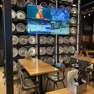 TV&apos;s and keg display on the inside of the restaurant.