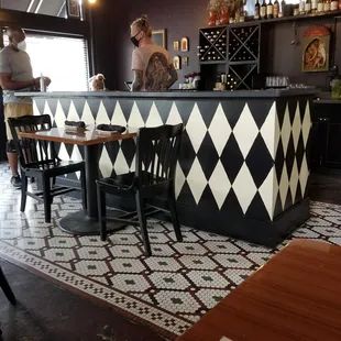 a man standing at a bar