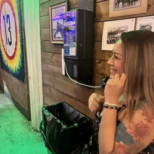 Laughing with Wife using payphone prop.