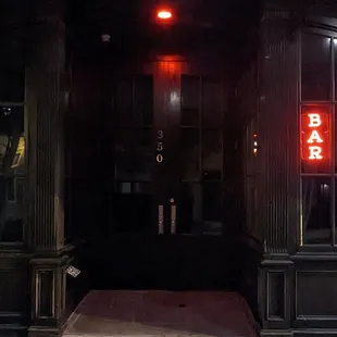 the entrance to a bar