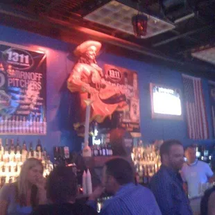 a crowd of people at a bar