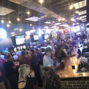 a large group of people at a bar