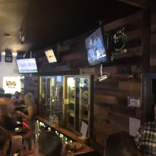 a group of people sitting at a bar