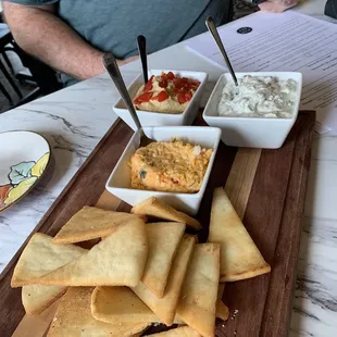 Trio dip with hummus, pimento cheese, and tziki dips!