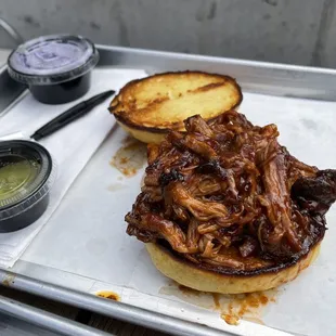 a pulled pork sandwich on a bun