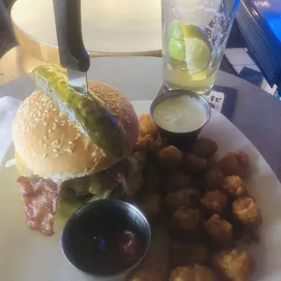 Bacon cheeseburger and Tater Tots  and bud light with lime