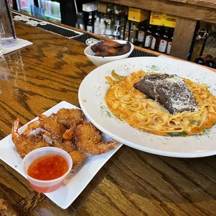 Coconut shrimp and the Rasta Pasta. Pasta is spicy, but awesome!