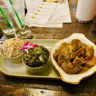 Curry goat, callaloo, and rice and peas.