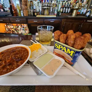 a bowl of soup and a bowl of chicken nuggies