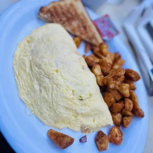 an omelet, toast, and hash browns