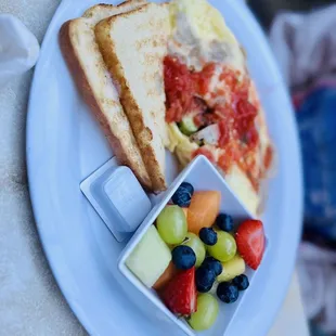 a plate of fruit and toast