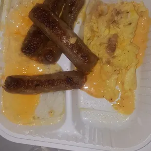 Sausage with  cheese eggs and cheese grits