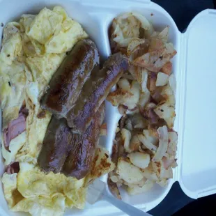 a breakfast of eggs, sausage, and hash browns