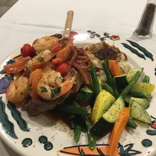 Charbroiled N.Y steak w/ the Cancun pawns aka "Carlos special "with baked potato and mix veggies