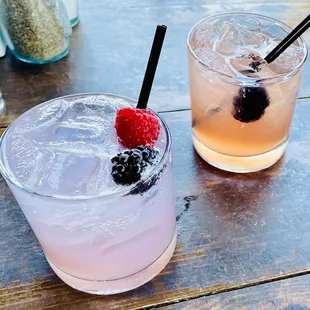 two cocktails on a wooden table