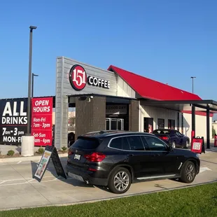 a car parked in front of a coffee shop