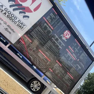 a car parked in front of a sign