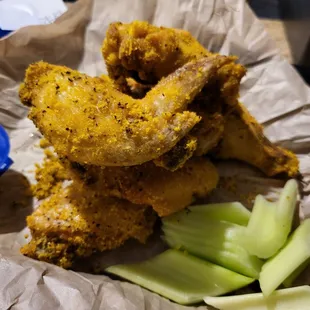 fried chicken wings and celery
