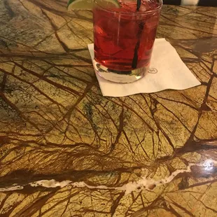 a drink on a marble table