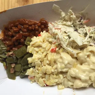 This is not how they would normally serve it but I asked for a sample of all of the sides. Baked beans, smoked green beans, coleslaw, &amp; mac