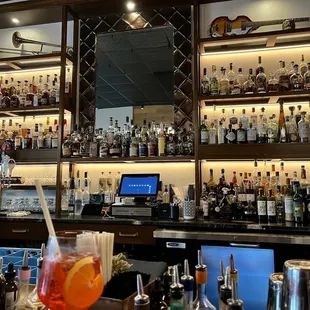a bar filled with bottles of alcohol