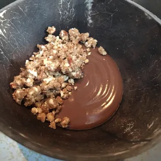 Bittersweet Valrhona chocolate custard, toasted curry, coconut lace cookie**