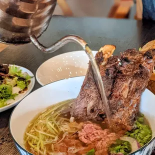 Pho Rib - Vietnamese beef broth with Filet Mignon, Grilled Ribs &amp; a Vital Farm Egg.