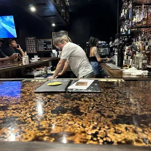 a man working at a bar