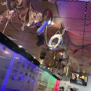 a fish net suspended from the ceiling