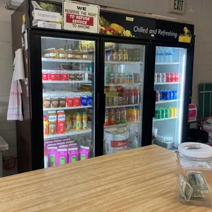 View of cold beverages -- Martinelli&apos;s Apple juice, Crystal Brand Milk, James Farm Half &amp; Half, Snapple, Sunny D, Kerns Juices &amp; Gatorade.
