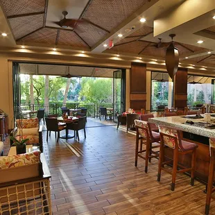 a view of the bar and dining area