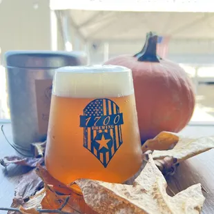 a glass of beer on a table