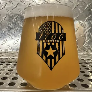 a glass of beer on a table