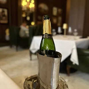 a bottle of champagne in an ice bucket